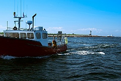 Fishing Boat with Straitsmouth Island Light in the Background